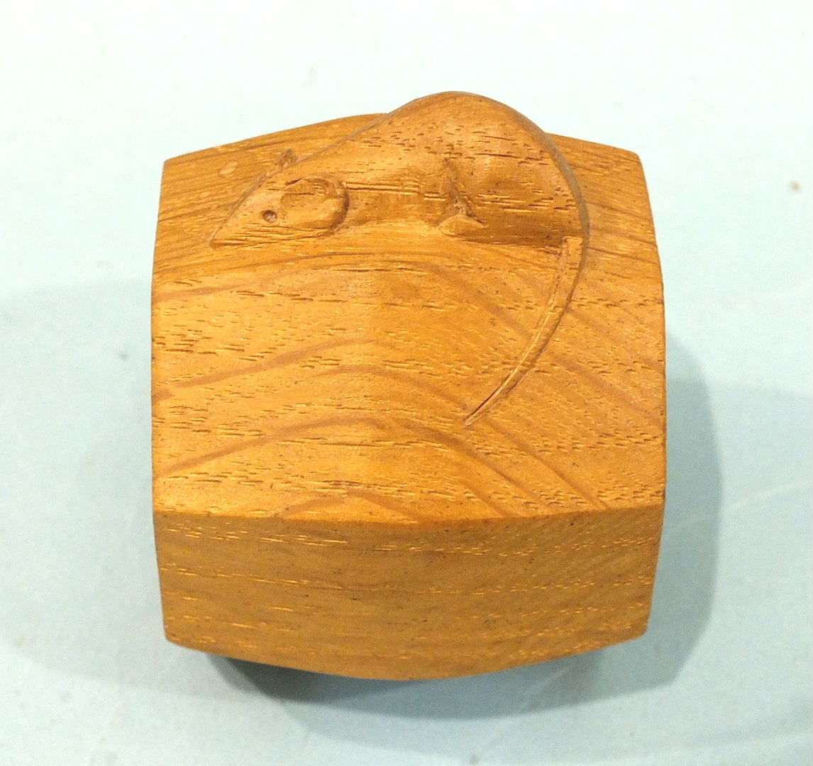 A Robert (Mouseman) Thompson carved oak octagonal napkin ring, 7cm high.