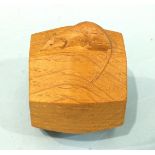 A Robert (Mouseman) Thompson carved oak octagonal napkin ring, 7cm high.