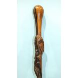 An African hardwood walking stick carved with a snake and a salamander, 93cm long.