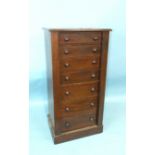 A Victorian walnut Wellington chest of seven drawers, on plinth base, 51cm wide, 106cm high.