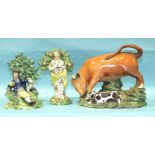 An early-19th century Staffordshire pearlware Bull Baiting group, 18cm high, 20cm wide and two