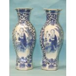 A pair of 19th century Chinese large porcelain vases decorated with panels of ladies on a terrace,