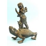 A Chinese bronze figure group of Lui Hai riding on a three-legged toad, 17cm high.