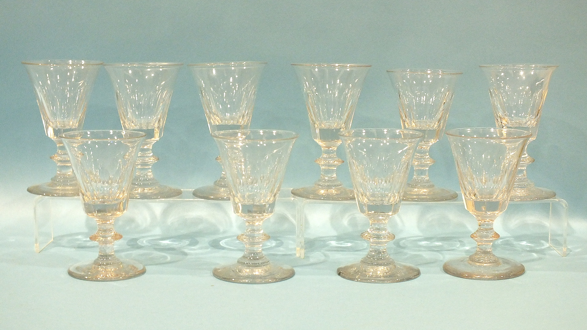 A set of ten small cut wine glasses, 11 - 11.5cm.