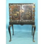 A Georgian lacquered cabinet on stand, having a pair of lacquered and mother-of-pearl doors with