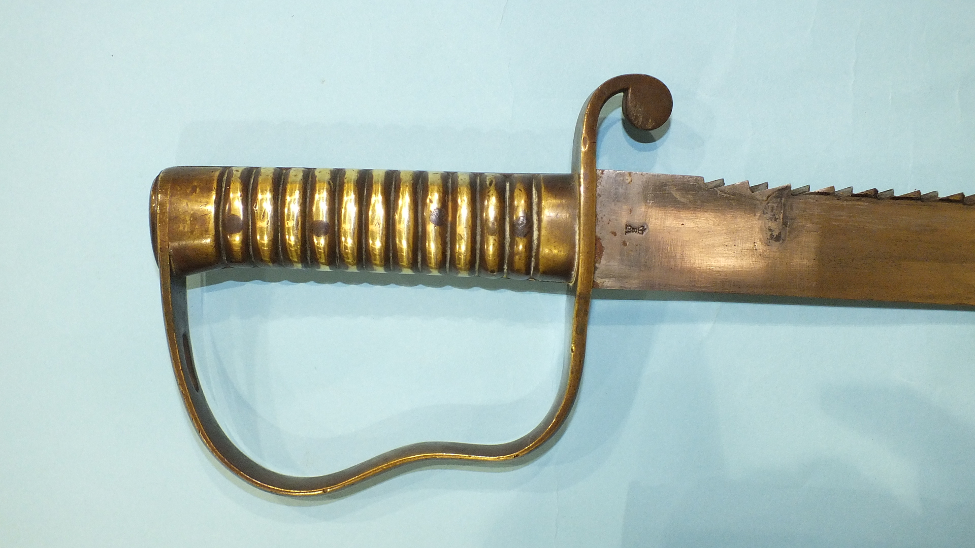 A British Pioneer sword with brass hilt and saw backed blade, 57cm, marked with crown over B21 and - Image 4 of 4
