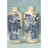 A pair of 19th century Chinese blue and white slender porcelain vases decorated with aquatic