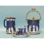 A Wedgwood jasperware biscuit barrel, 14.5cm with plated mounts and lid, a similar jug, 16.5cm