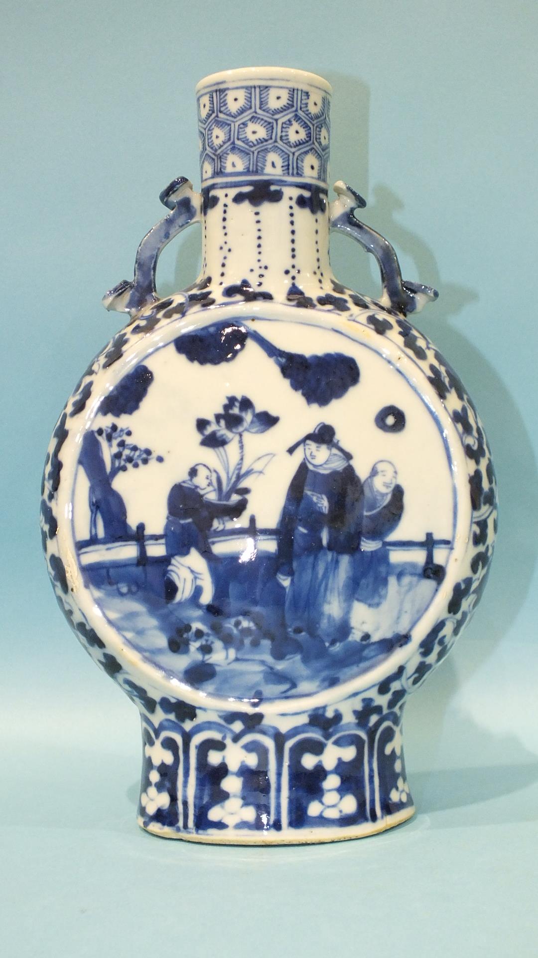 A 19th century Chinese blue and white moon flask decorated with figures in garden settings, Kang Hsi