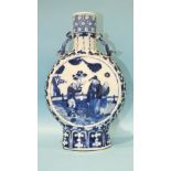 A 19th century Chinese blue and white moon flask decorated with figures in garden settings, Kang Hsi