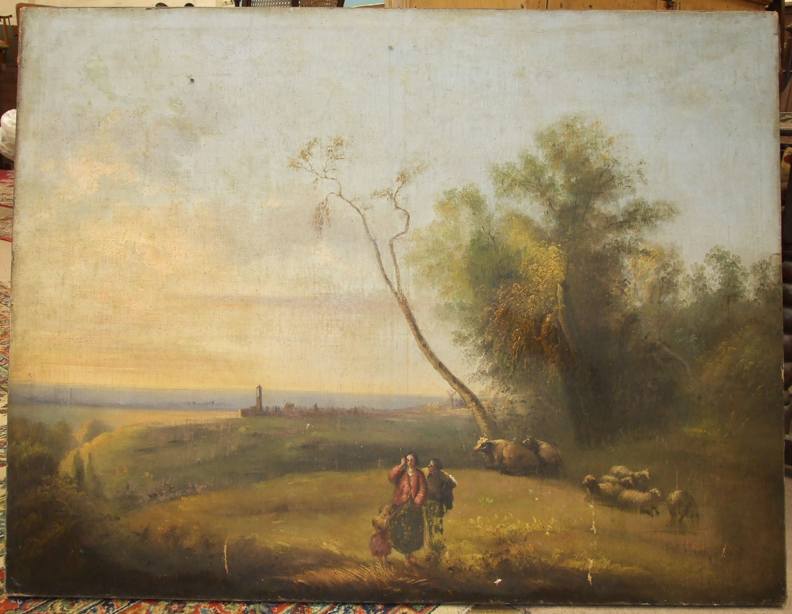 19th century Continental School LANDSCAPE WITH FIGURES AND SHEEP IN THE FOREGROUND Oil on canvas,