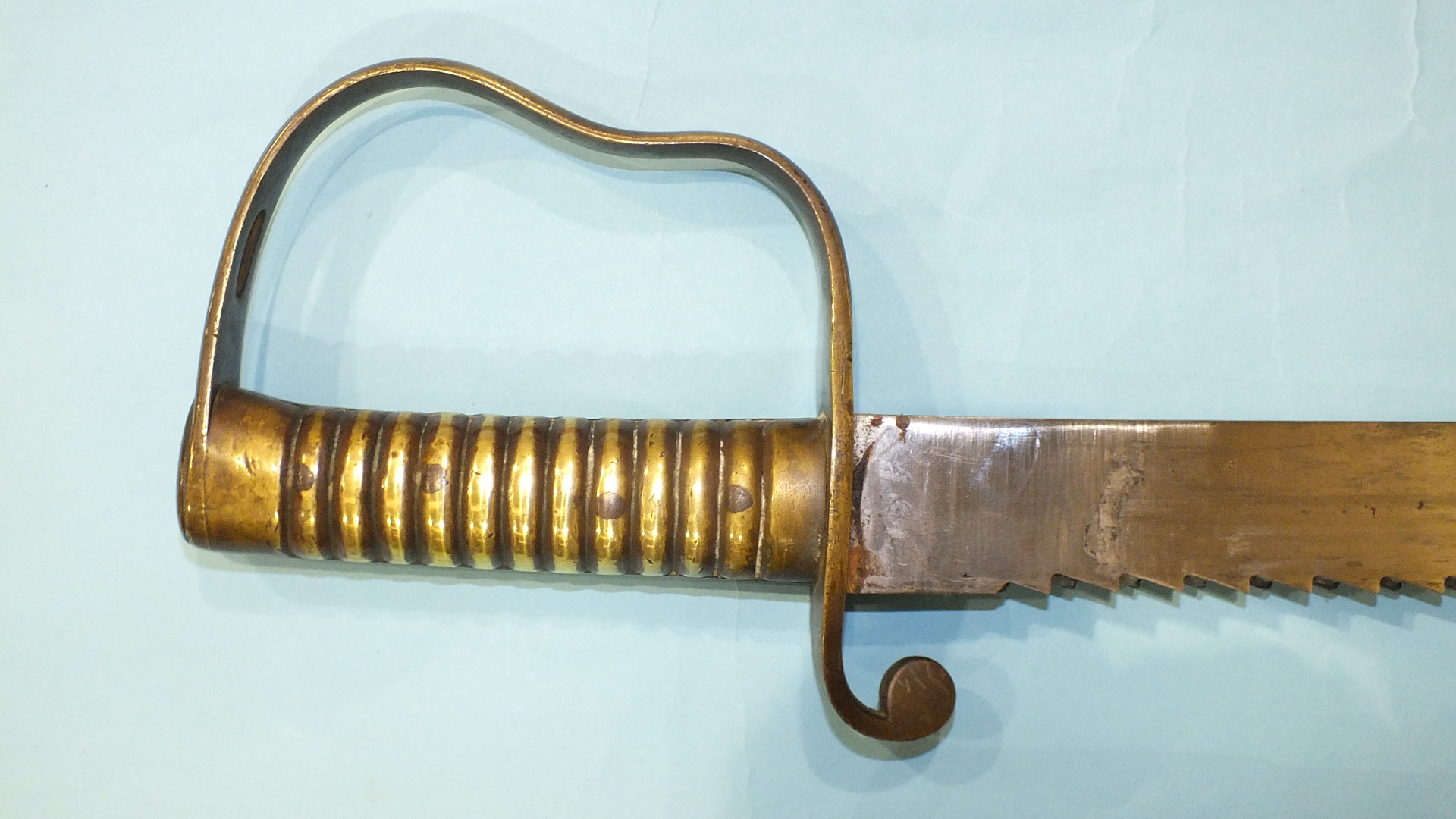 A British Pioneer sword with brass hilt and saw backed blade, 57cm, marked with crown over B21 and - Image 3 of 4