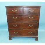 A George III mahogany rectangular chest of two short and three long cockbeaded drawers, with period,