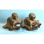 A pair of Burmese carved wood figures at prayer, 50cm long, 26cm high.