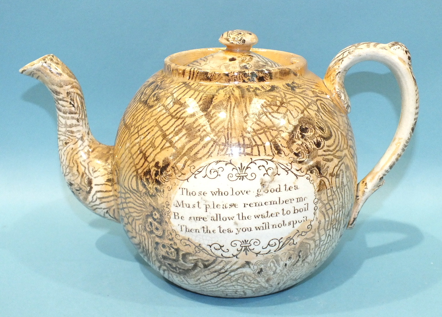 A late 19th century transfer-printed and lustre decorated tea pot of globe shape, the cartouche - Image 2 of 2