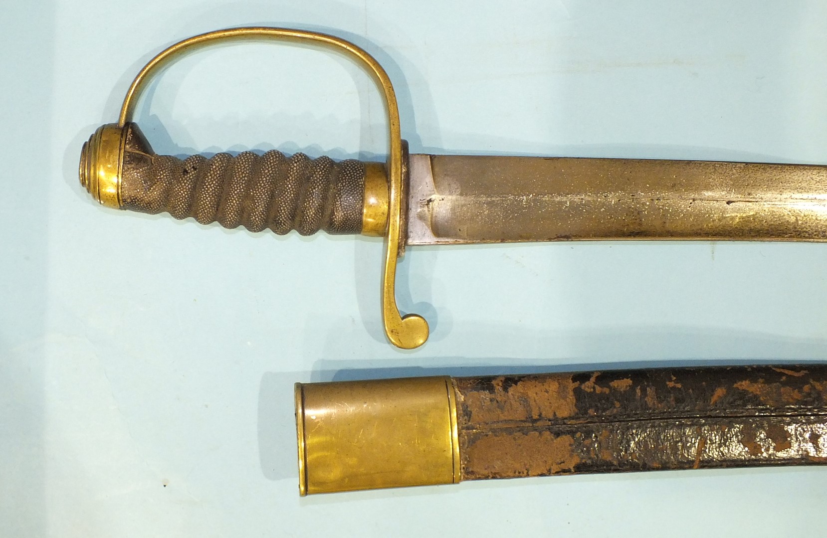 A brass stirrup hilted short sabre with fish-skin grip and 61cm slightly curved blade in brass - Image 3 of 4