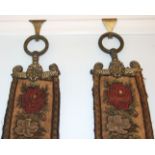 A pair of Victorian petit-point needlework bell-pulls with gilt brass ornate hangers.