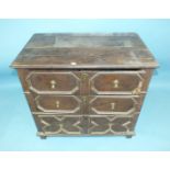 An antique oak chest of three long drawers with applied geometric moulding, 87cm wide, 79cm high, (