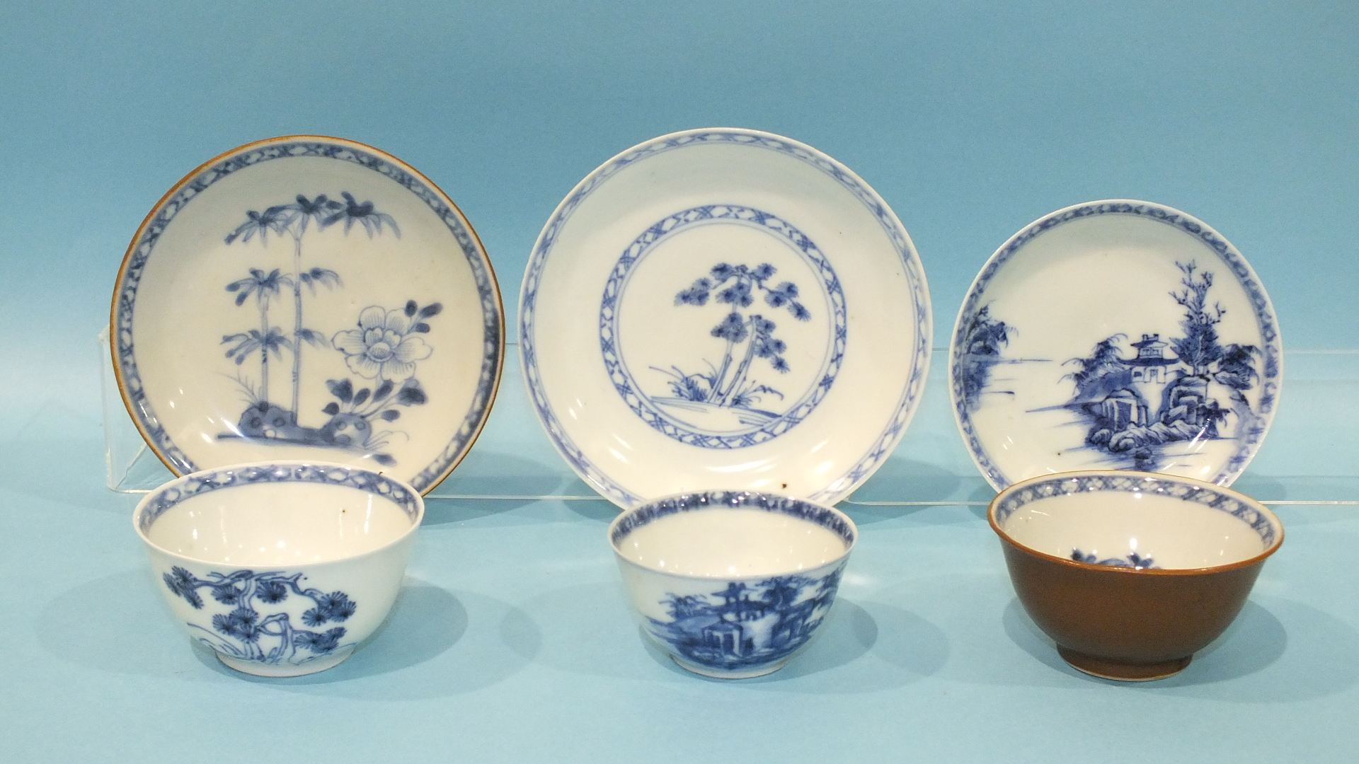 A group of three Nankin Cargo tea bowls and saucers, Chinese c1750, together with the original