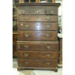 A Georgian mahogany chest on chest, the cornice and blind fret frieze above three small and six long