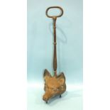 A brass fox mask door-stop with long handle, 48cm high.