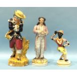 A 19th century Staffordshire porcelain figure of a Negro dancer, 16cm, a figure of a man