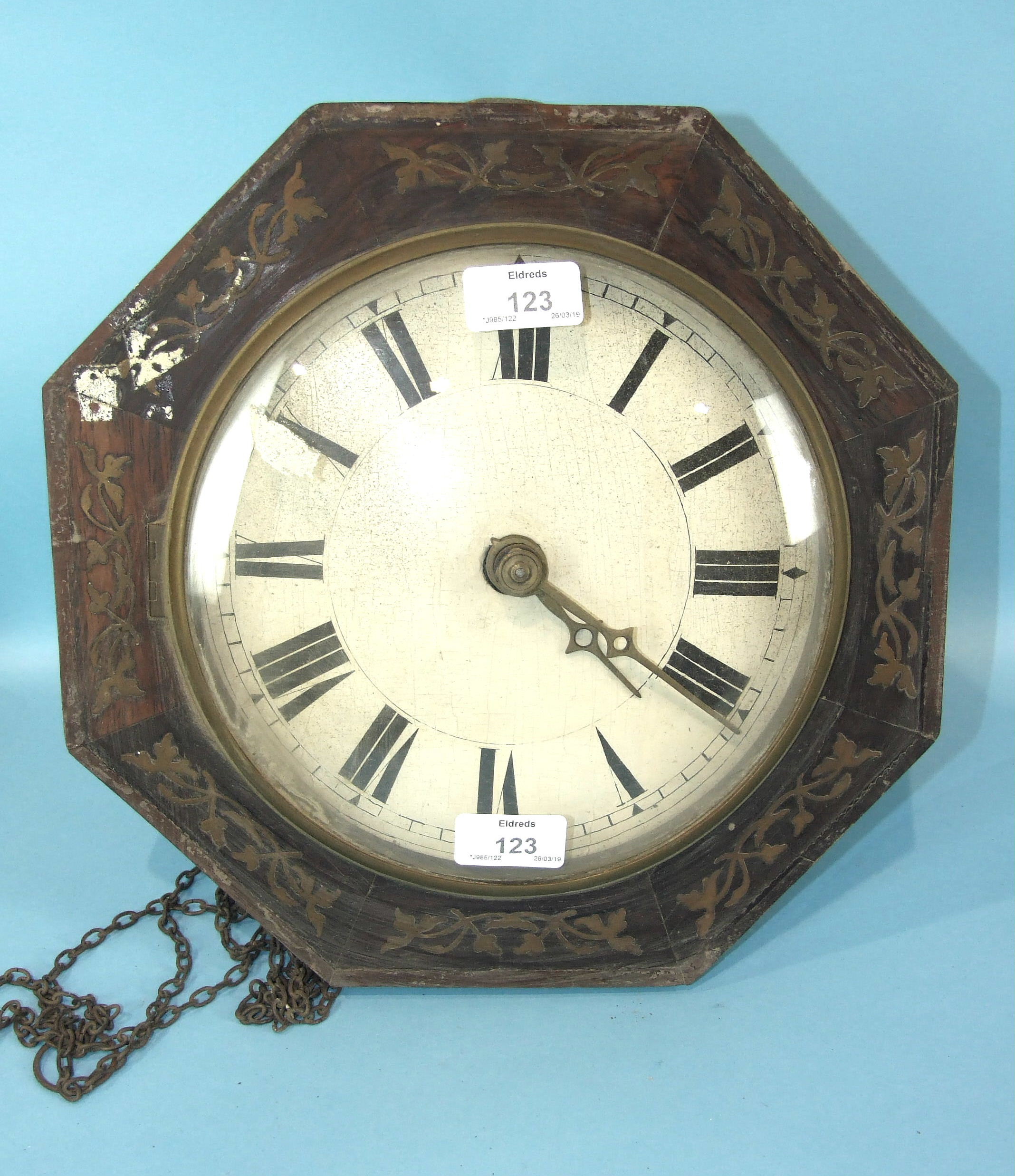 A 19th century octagonal and brass inlaid wall clock, the convex painted dial with chain-driven