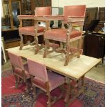 A limed oak dining suite, comprising: a rectangular dining table, 181.5 x 86cm, a sideboard and