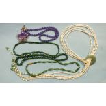 A necklace of freshwater pearls and aventurine quartz, three strings of malachite beads and an agate