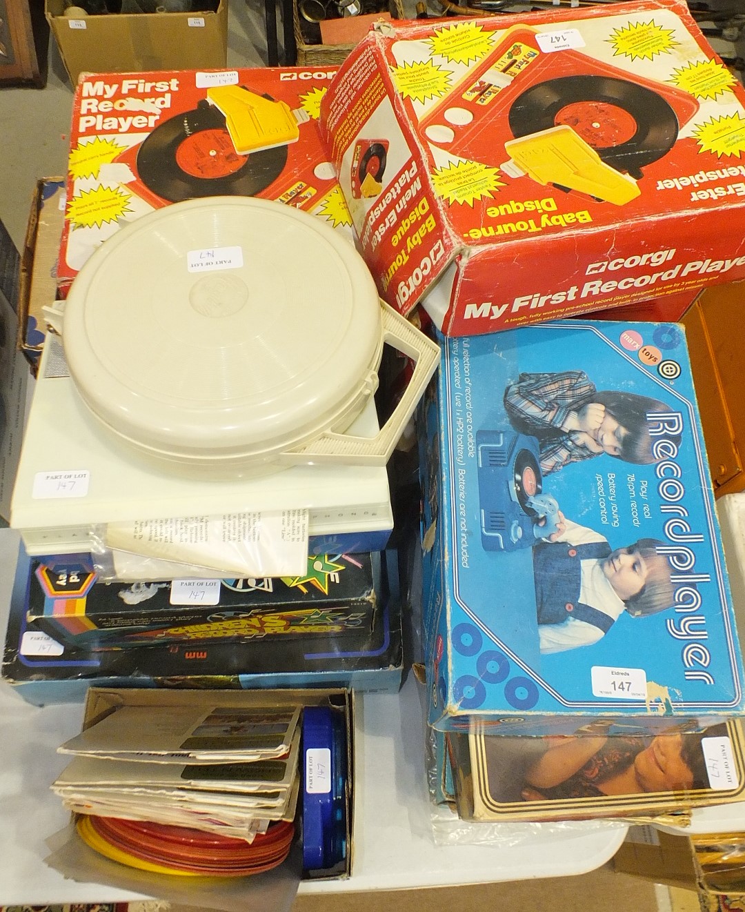 Four Marx toy record players and eleven others, including Corgi, Chad Valley and Lumar, (15).