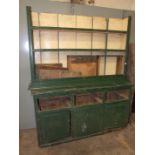 An antique painted pine dresser in poor condition, needing restoration, 192cm wide, 62cm high.