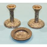 A pair of modern foliate embossed short silver candlesticks, Birmingham 1980, 11cm high and a