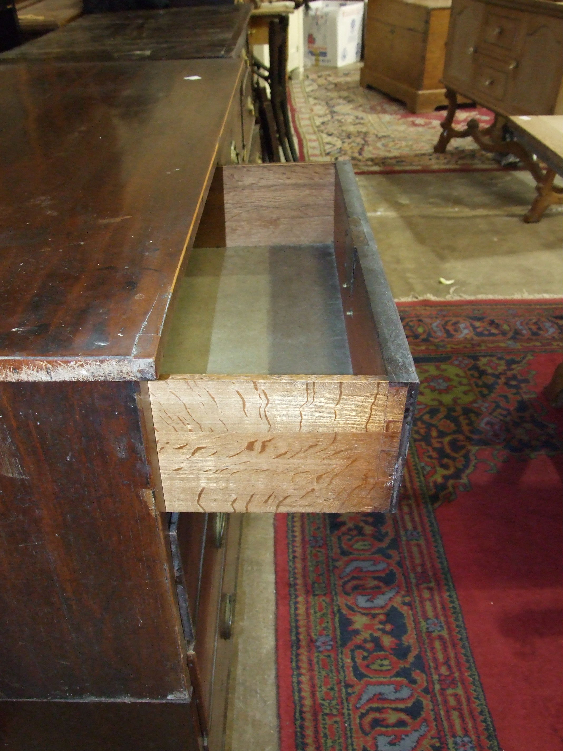 A Georgian mahogany chest of two short and three long cockbeaded drawers on bracket feet, in two - Image 2 of 2