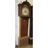 An early 19th century oak longcase clock with arched painted dial and twin-train bell-striking