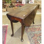 An 18th century Cuban mahogany oval drop-leaf dining table on turned legs with pad feet, 17 x