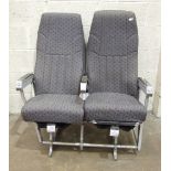 Two pairs of alloy-framed airline passenger seats with upholstered seats and reclining backs, arms