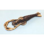 A brass Crown Cork bottle opener in the form of a lobster, 13cm long.