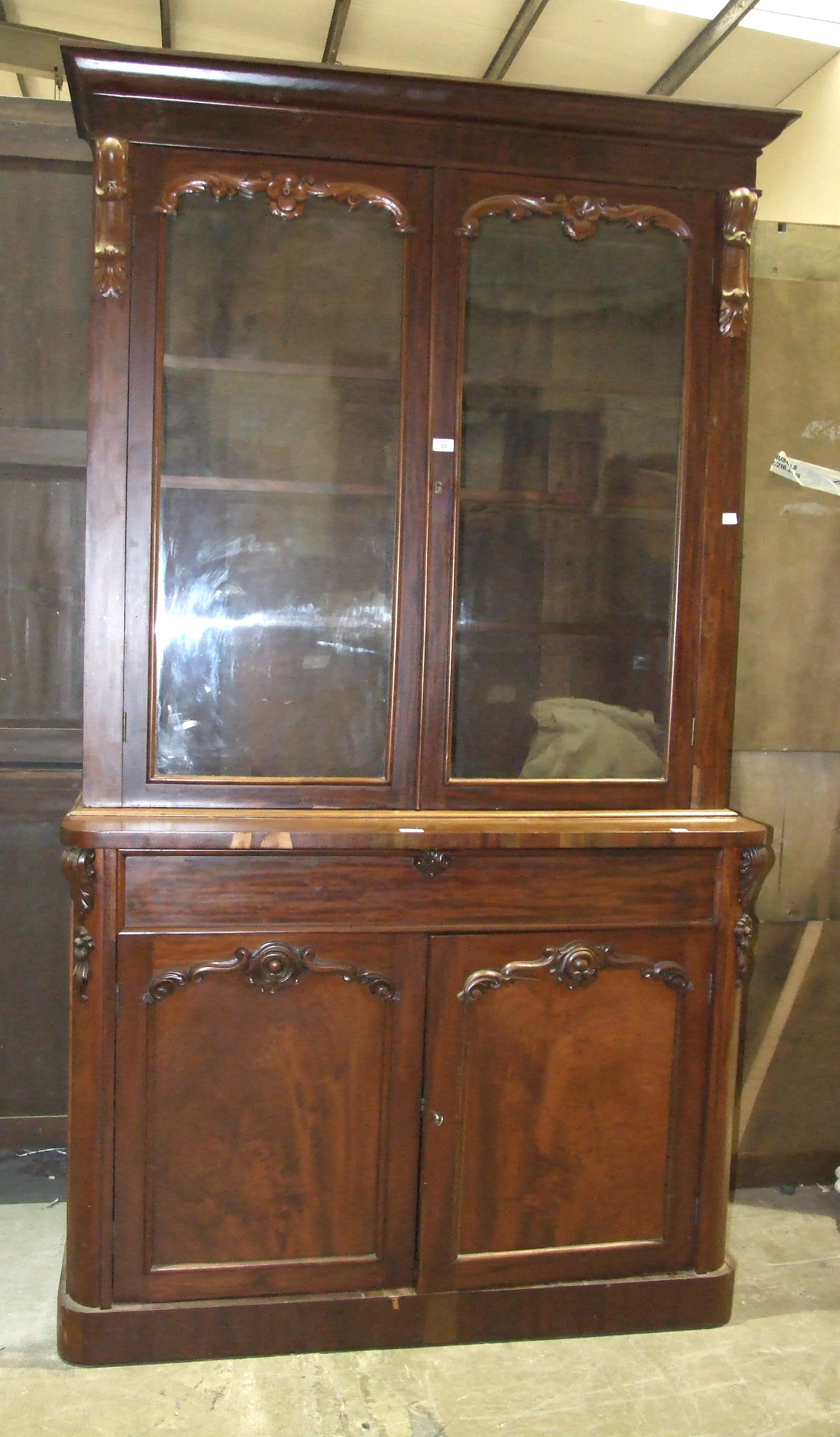 A Victorian mahogany bookcase, the cornice above a pair of glazed doors, a drawer and cupboard - Image 2 of 2