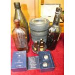 Four 'Goodyear' advertising tyre ashtrays, three miniature advertising bottles, (2 x Guinness, 1 x