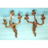 A pair of gesso three-branch wall-mounted candle holders, an inlaid walnut over-mantel mirror, 71