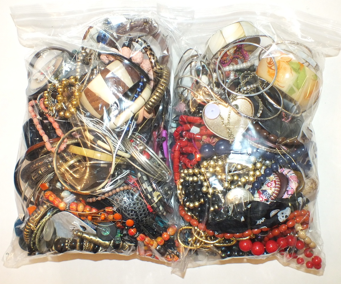 A quantity of costume jewellery, the contents of two bags.