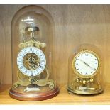 A reproduction skeleton timepiece with white dial, under glass dome, 28cm high and a 20th century