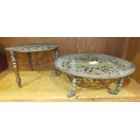 An unusual brass coaster, the circular extending pierced top on short turned legs with castors, 23cm