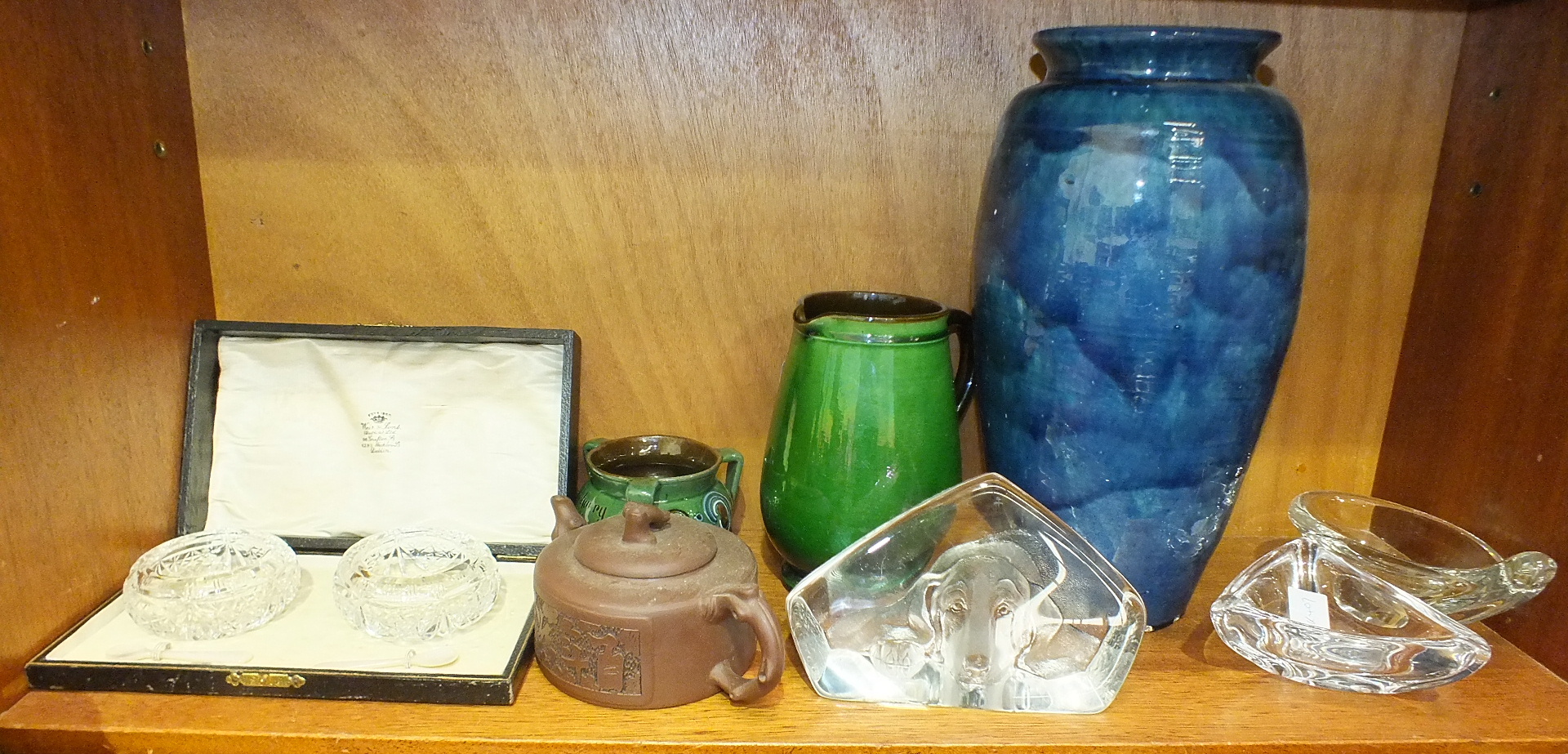 A pair of cut-glass circular salts, 8cm diameter, in fitted box marked 'Weir & Sons (Dublin) Ltd', a