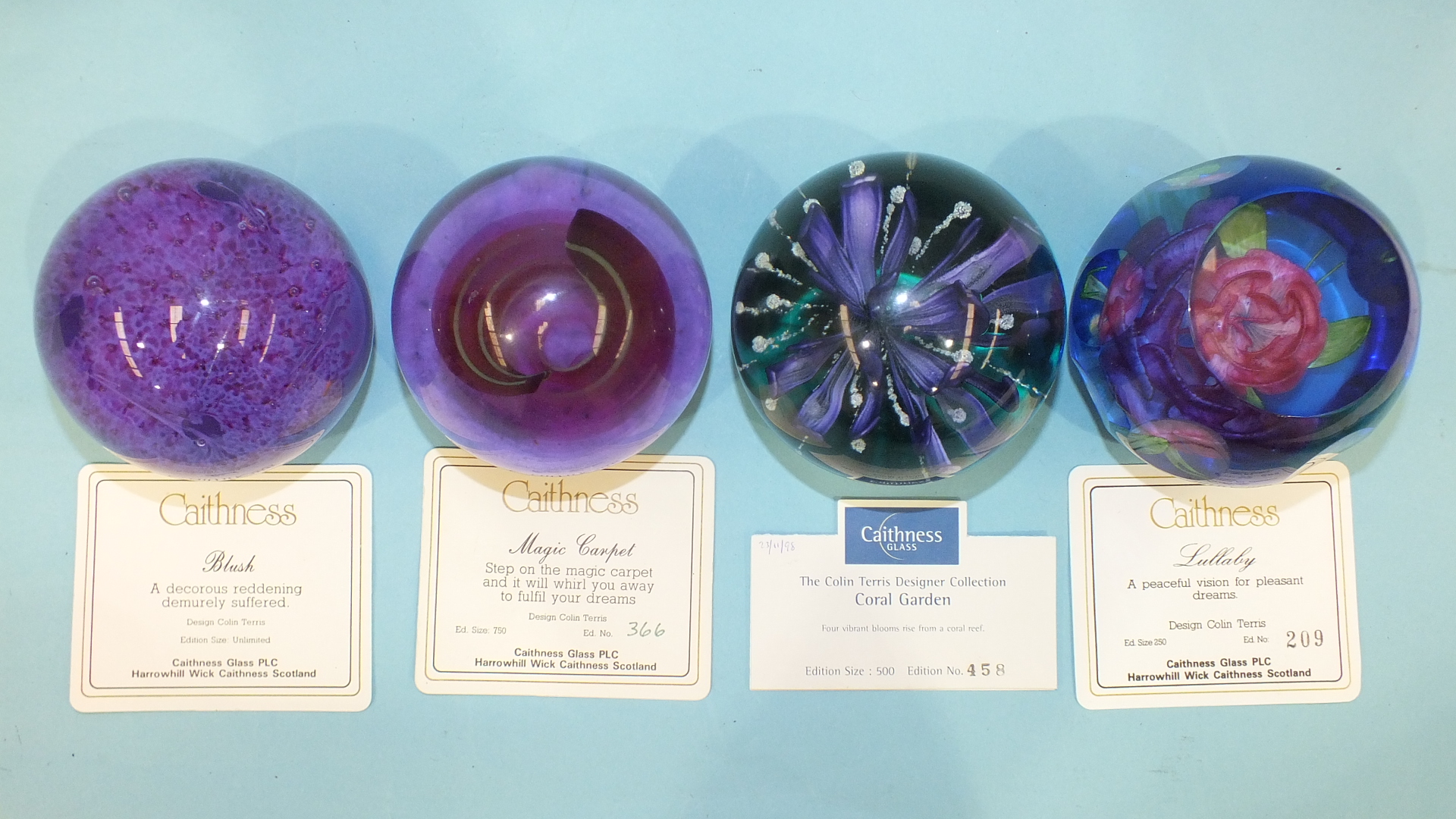 Three Caithness limited-edition glass paperweights 'Magic Carpet' 366/750, 'Coral Garden' 458/500