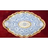 An 18th/19th century Flight Worcester oval dish decorated blue and gilt with underglaze blue