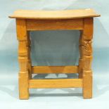 Wilf (Squirrelman) Hutchinson, an oak stool, the shaped seat on carved and turned legs joined by