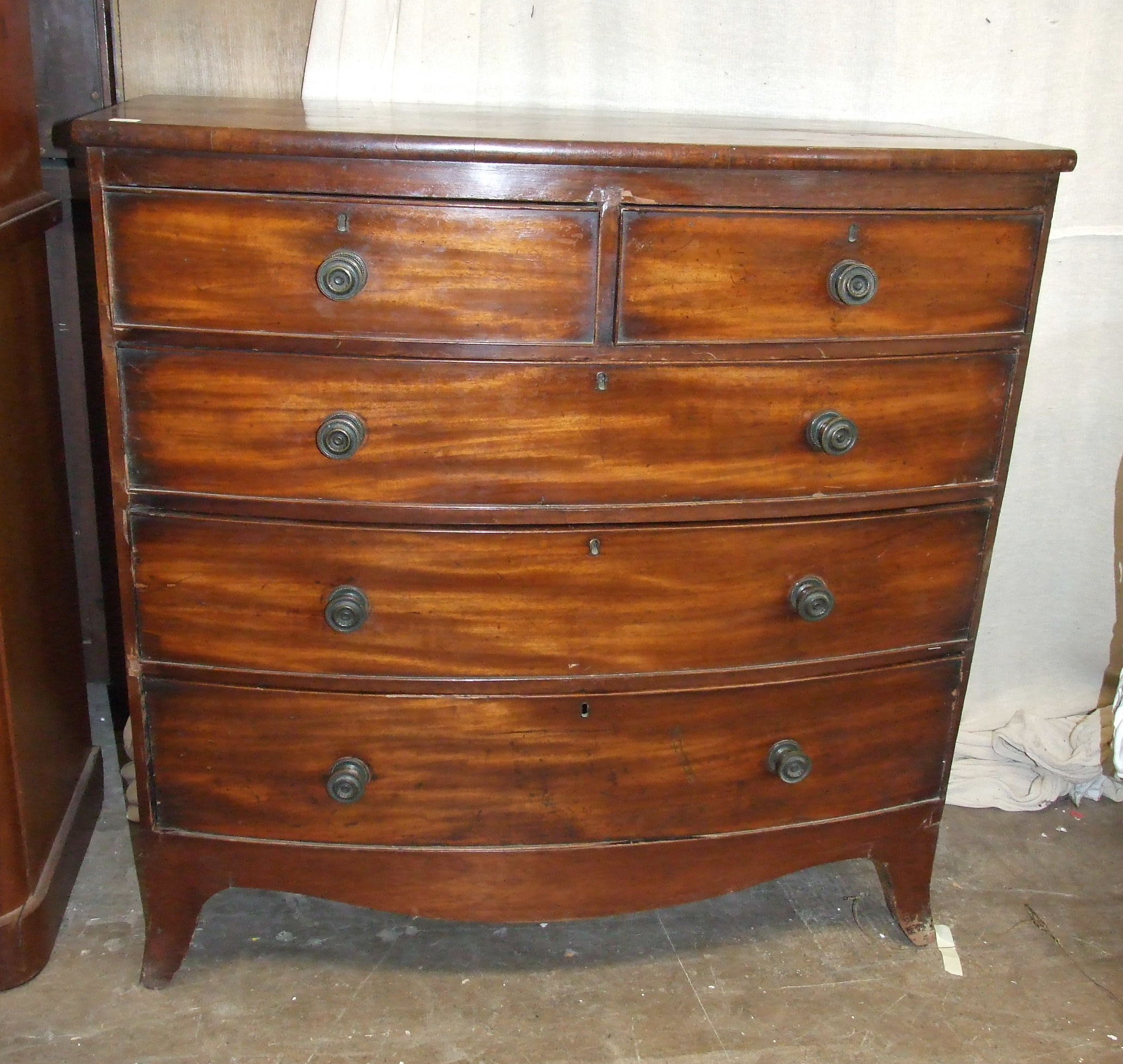 A Victorian bow-fronted chest of two short and three long drawers, on bracket feet, 103cm wide,