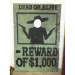 A large fairground 'Face-in-Hole' board painted 'DEAD OR ALIVE', over silhouette of a bandit and '