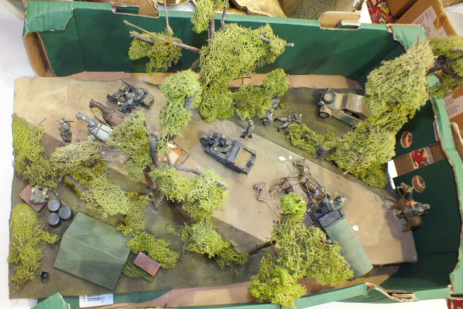 A plastic partially scratch-built diorama of German WWII troops, 60 x 30cm.